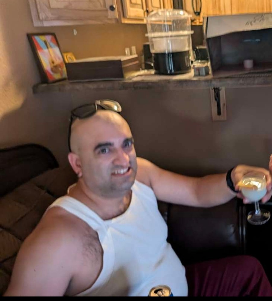 Grant holding a glass of Thin Milk